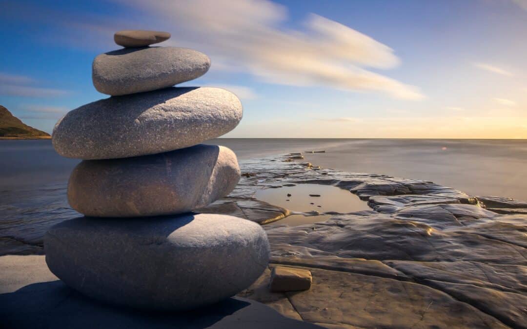 stacked rocks on the sea shore